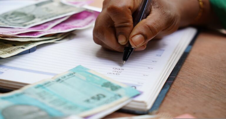 A man documenting his financial records