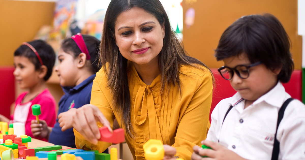 Teacher conducting an activity with young students